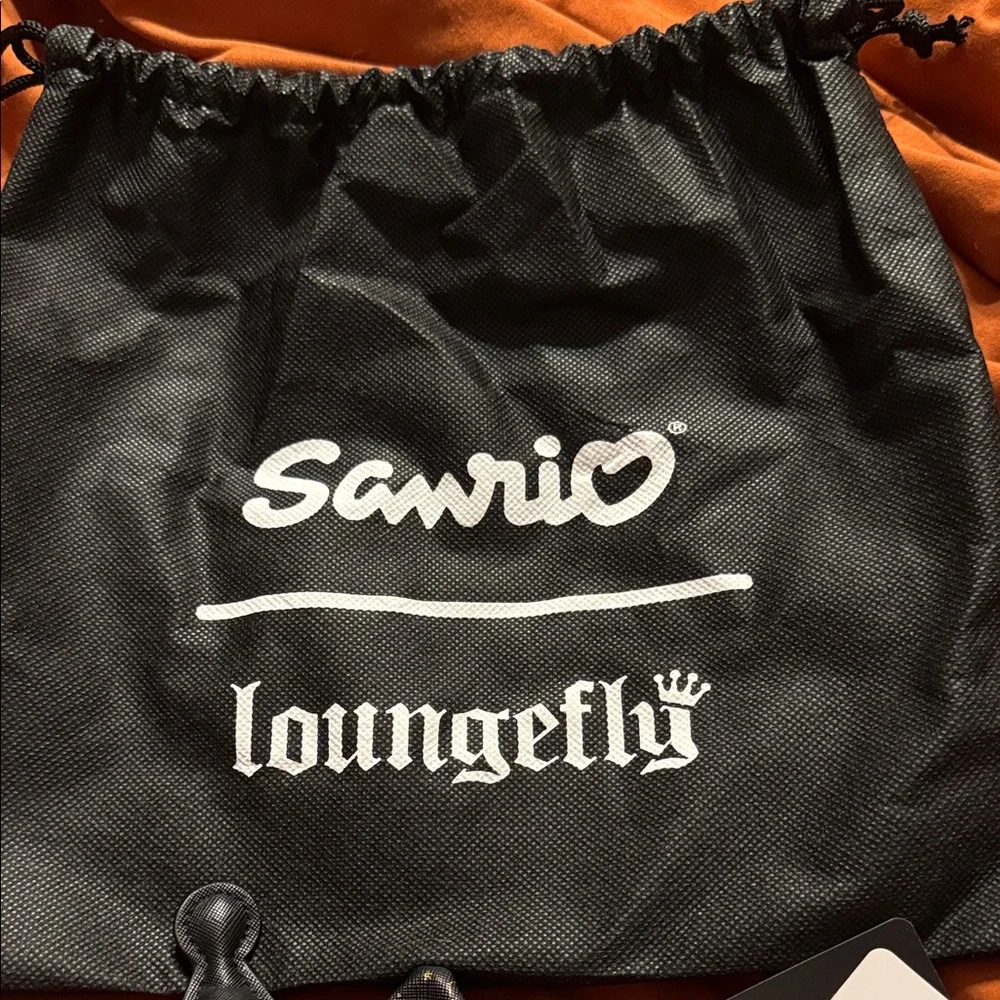 Loungefly Kuromi Black Faux-Leather Cat Ear Headband with Pink Skull Bow - Picture 7 of 7